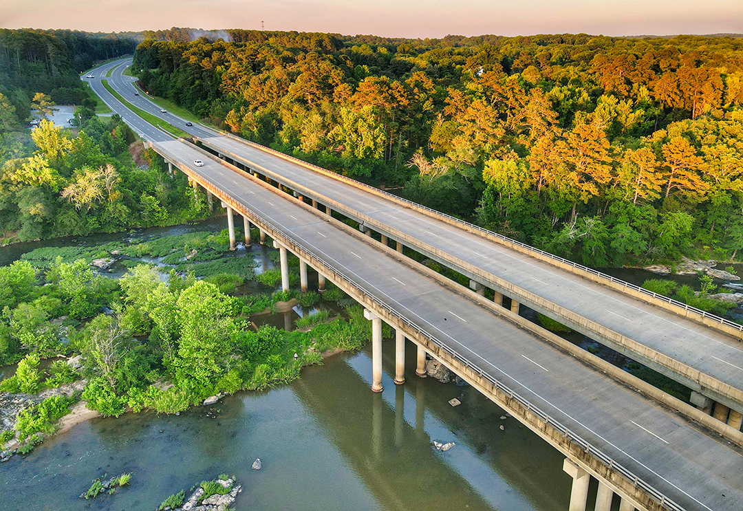 A freeway crossing a natural area and river